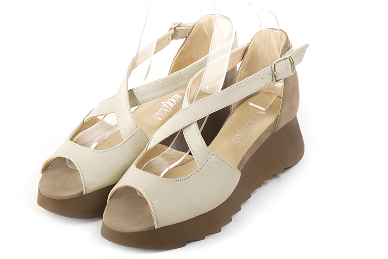 Off white and tan beige women's closed back sandals, with crossed straps. Round toe. Low rubber soles. Front view - Florence KOOIJMAN